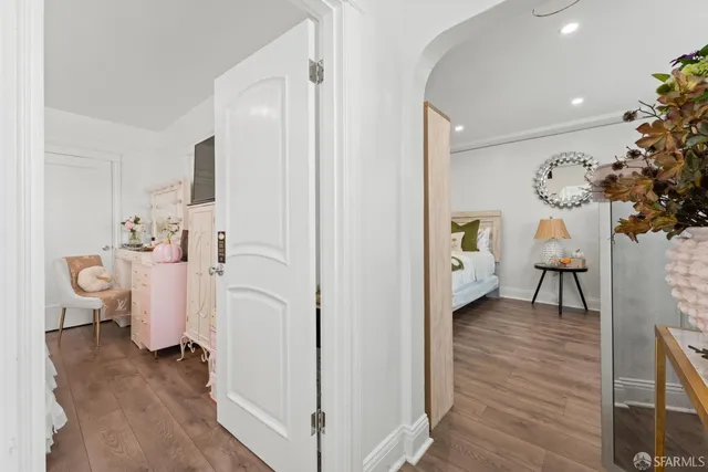 a view of kitchen with furniture and wooden floor