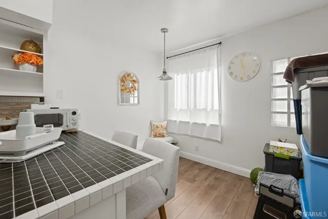 a living room with window and a table