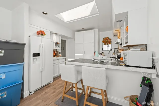 a kitchen with a sink cabinets and appliances