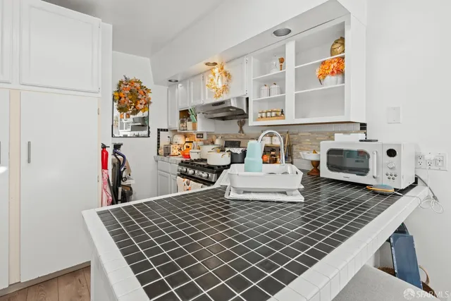 a bedroom with furniture and a book shelf