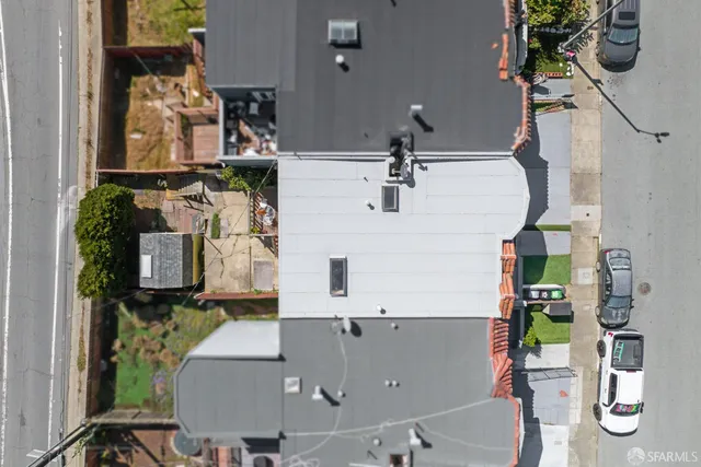 a view of a patio with dining table and chairs