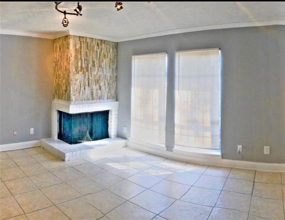 3190 Nectarine Circle Decatur, GA 30034 - Photo 2 of 6 an empty room with windows and fireplace