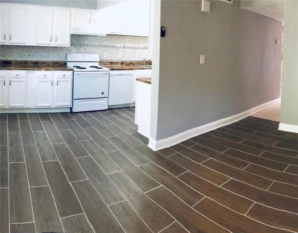 3190 Nectarine Circle Decatur, GA 30034 - Photo 3 of 6 a kitchen with granite countertop a sink and a stove top oven