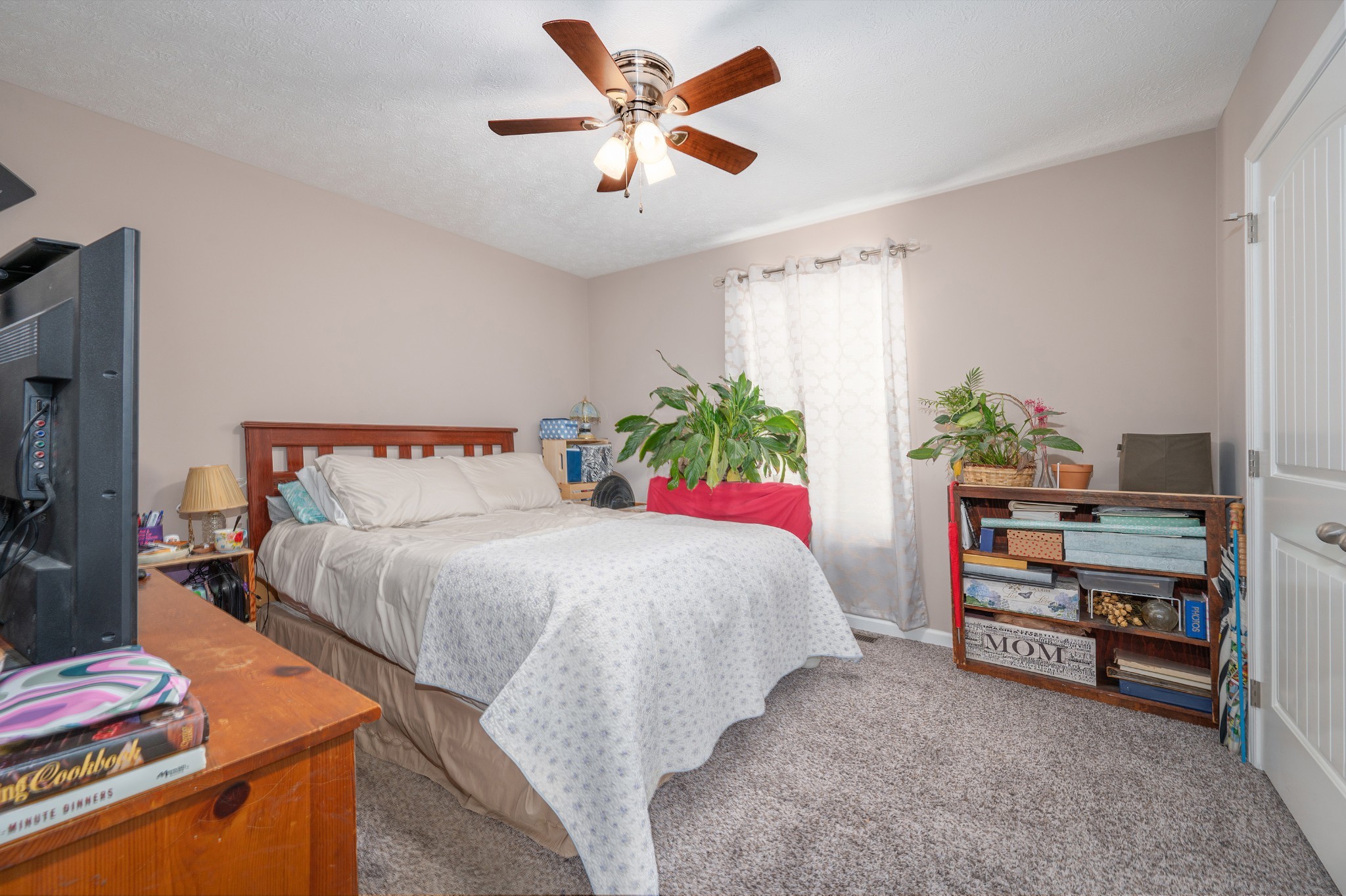 2995 Oak Grove Church Road Bethpage, TN 37022 - Photo 15 of 28 a bedroom with a bed and a flat tv screen