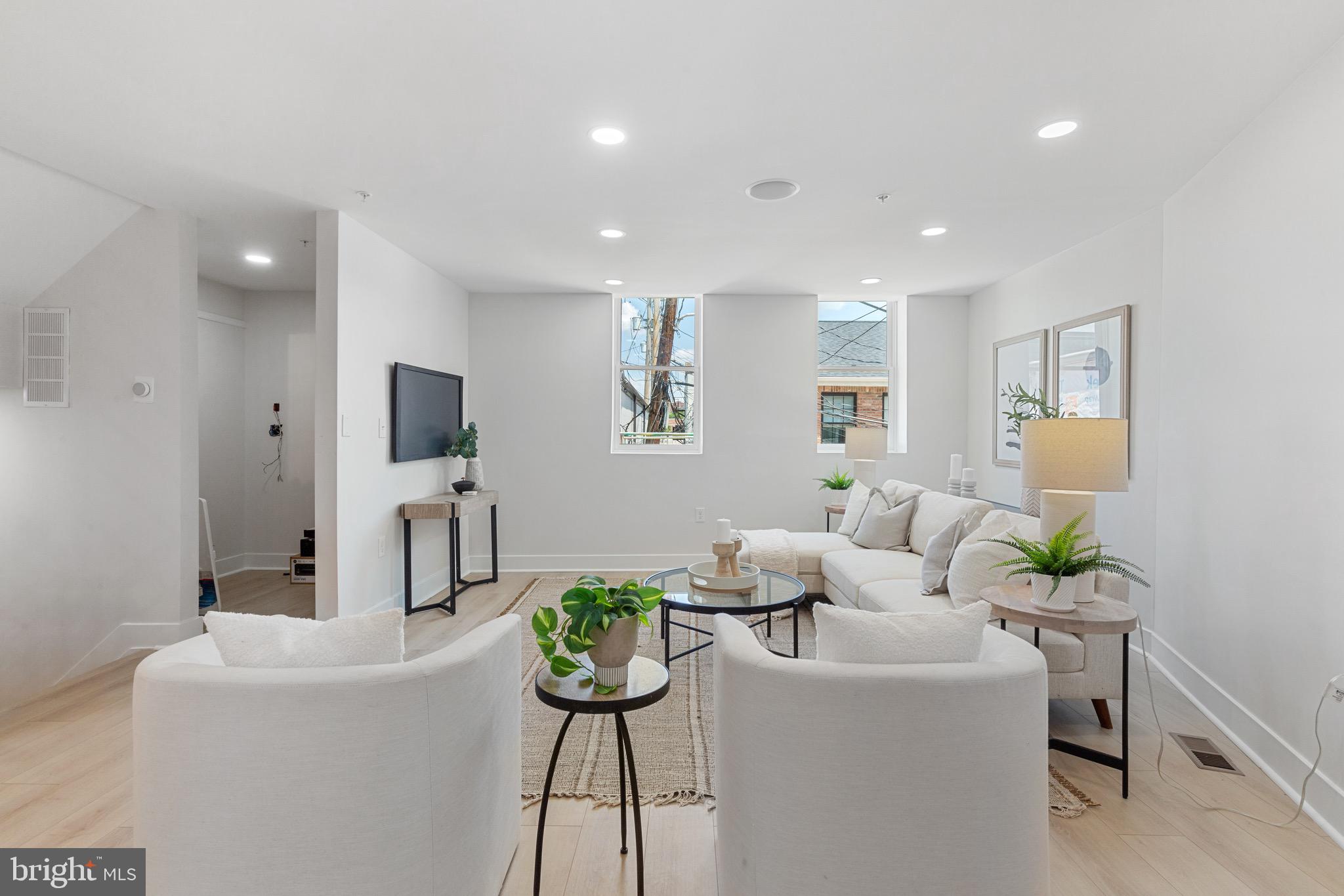 1601 Portugal Street Baltimore, MD 21231 - Photo 11 of 45 a living room with furniture and a flat screen tv