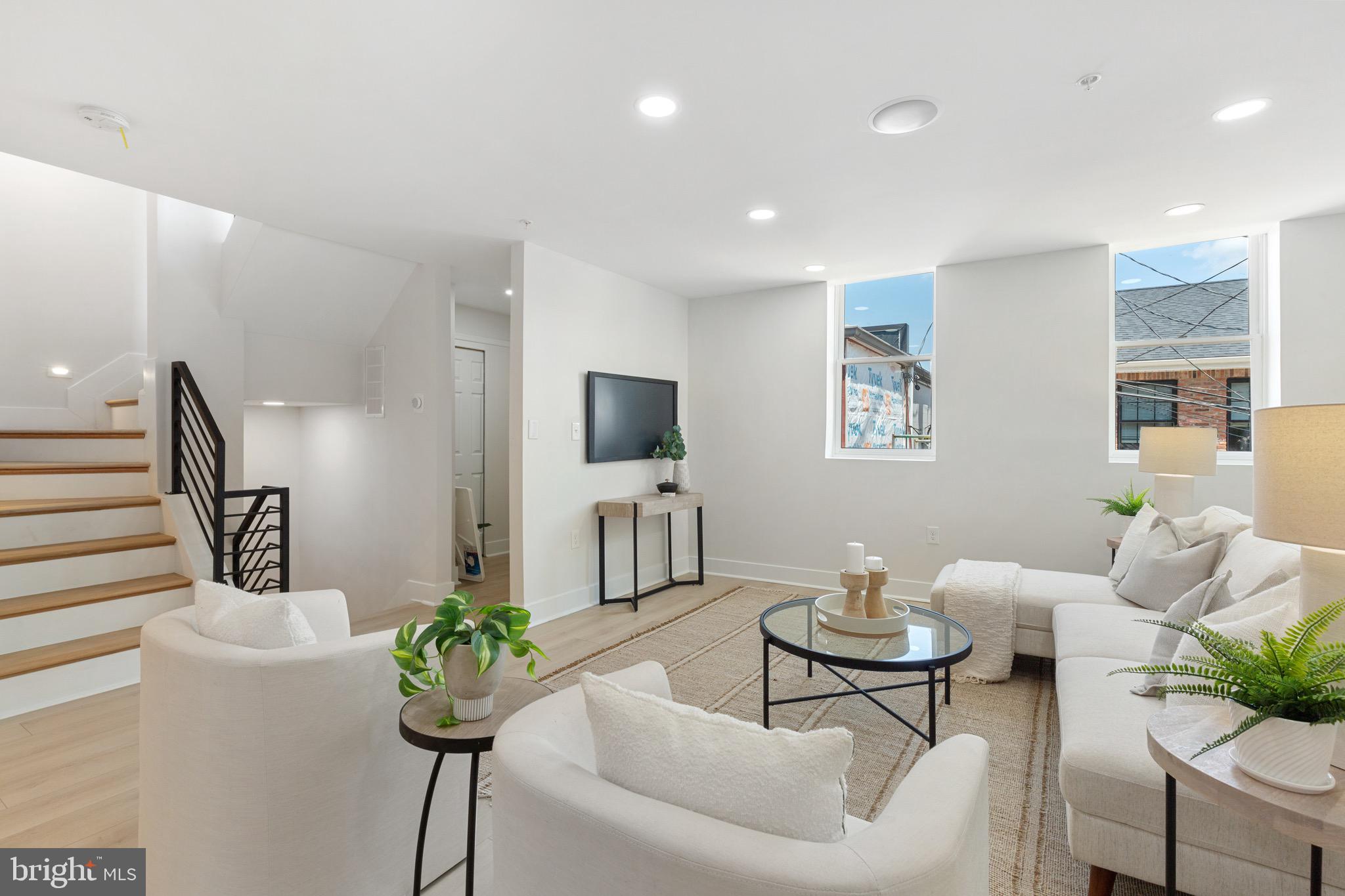 1601 Portugal Street Baltimore, MD 21231 - Photo 12 of 45 a living room with furniture potted plant and a window