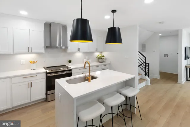 a kitchen with a sink cabinets and counter space