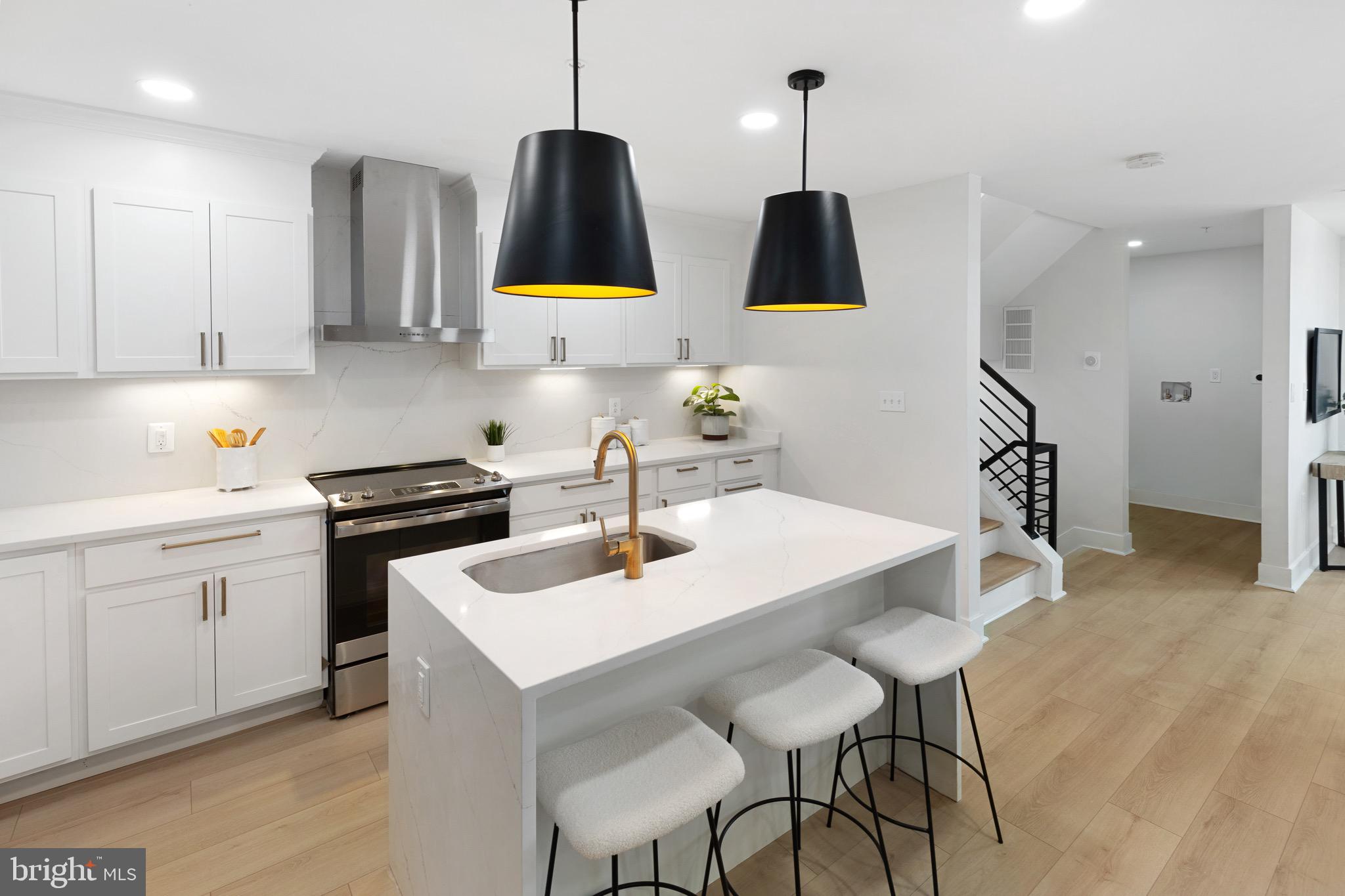 1601 Portugal Street Baltimore, MD 21231 - Photo 15 of 45 a kitchen with a sink cabinets and counter space