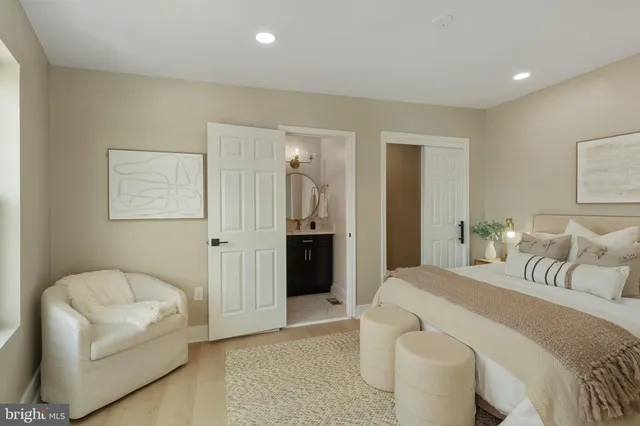 a bedroom with a bed and a couch