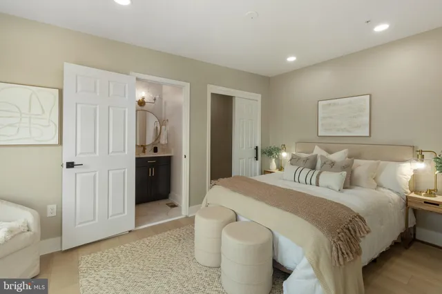 a spacious bedroom with a bed and a couch