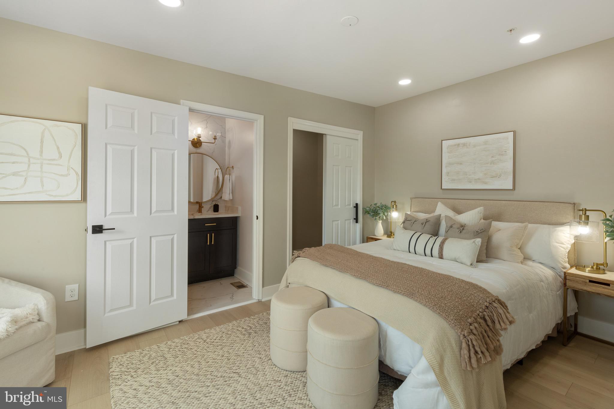 1601 Portugal Street Baltimore, MD 21231 - Photo 29 of 45 a spacious bedroom with a bed and a couch