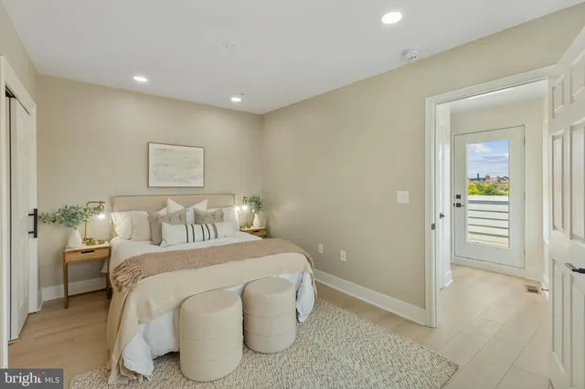 a bedroom with a bed and a table