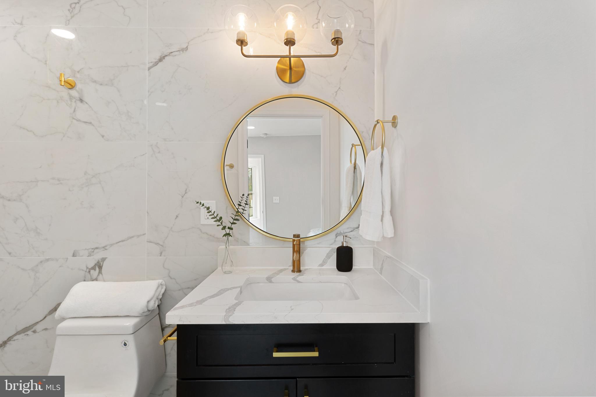 1601 Portugal Street Baltimore, MD 21231 - Photo 33 of 45 a bathroom with a sink and a mirror