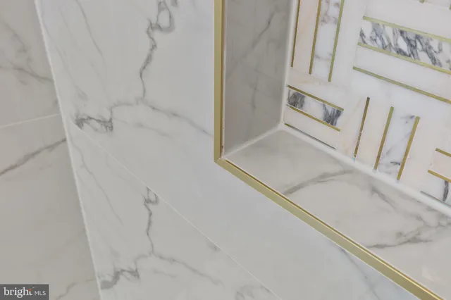 a bathroom with a mirror and a sink