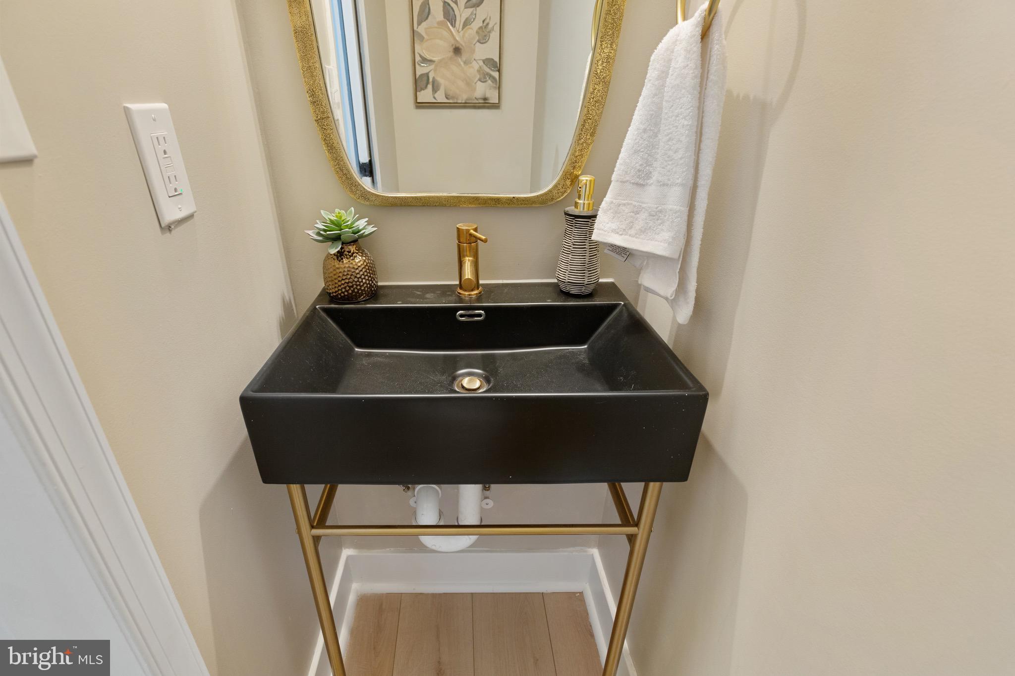 1601 Portugal Street Baltimore, MD 21231 - Photo 37 of 45 a close up of a sink and a mirror