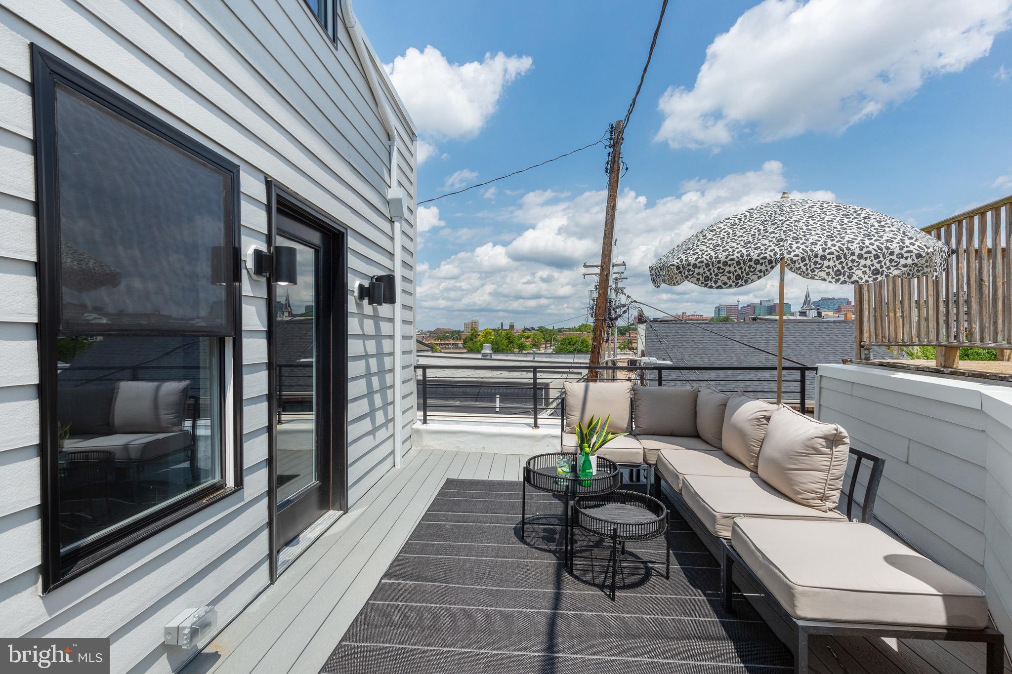 1601 Portugal Street Baltimore, MD 21231 - Photo 41 of 45 a balcony with furniture and a potted plant