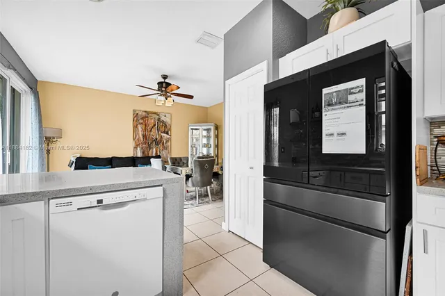 a bedroom with a bed and a wooden floor