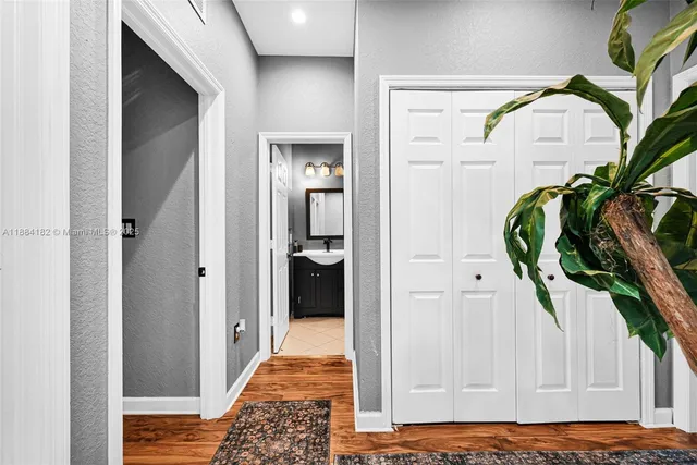 a view of a hallway with washer and dryer