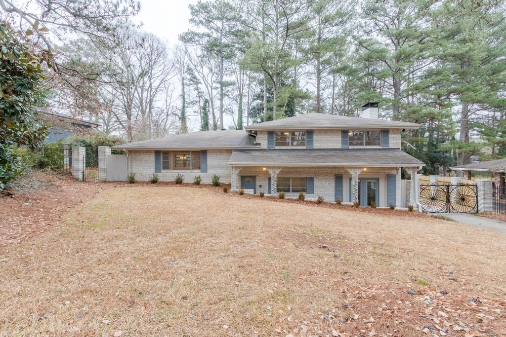 1264 June Drive Decatur, GA 30035 - Photo 1 of 1 a front view of a house with a garden