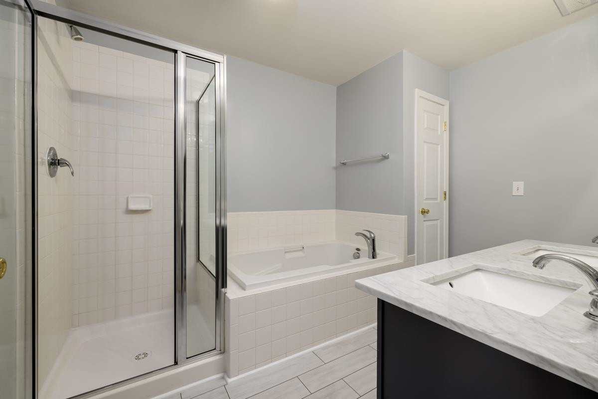 8610 Neuse Landing Lane, Unit 106 Raleigh, NC 27616 - Photo 19 of 28 Master's Bathroom