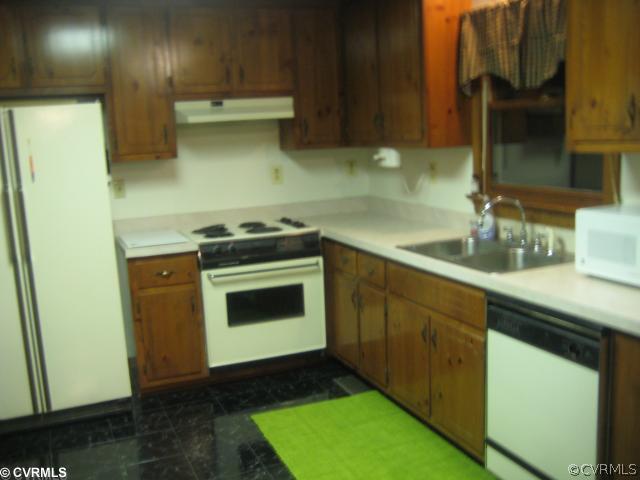 2240 Mill Road Henrico, VA 23231 - Photo 2 of 10 a kitchen with a sink and a stove next to a refrigerator