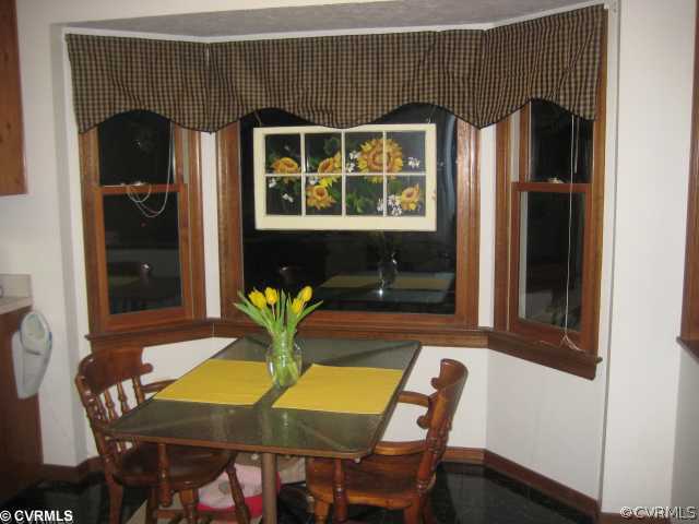 2240 Mill Road Henrico, VA 23231 - Photo 3 of 10 a view of a dining room with furniture and window