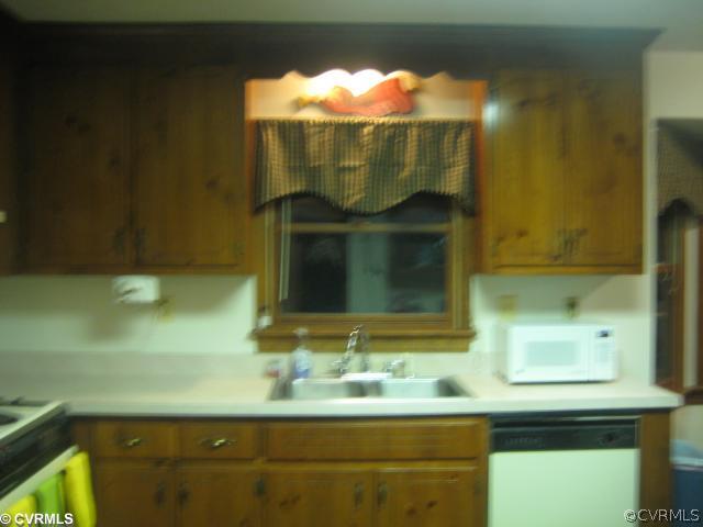 2240 Mill Road Henrico, VA 23231 - Photo 4 of 10 a bathroom with a sink and a mirror