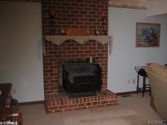 2240 Mill Road Henrico, VA 23231 - Photo 10 of 10 a living room with a fireplace