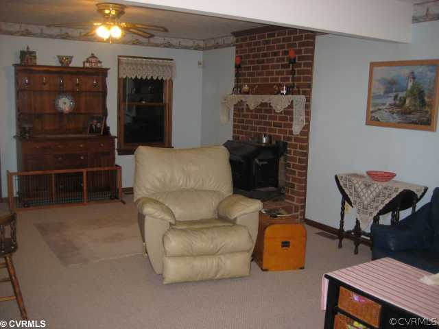 2240 Mill Road Henrico, VA 23231 - Photo 5 of 10 a living room with furniture a ceiling fan and a rug