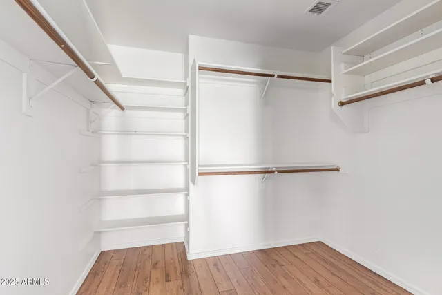 a view of an empty walk in closet