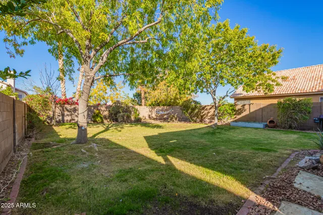 a view of yard with swimming pool