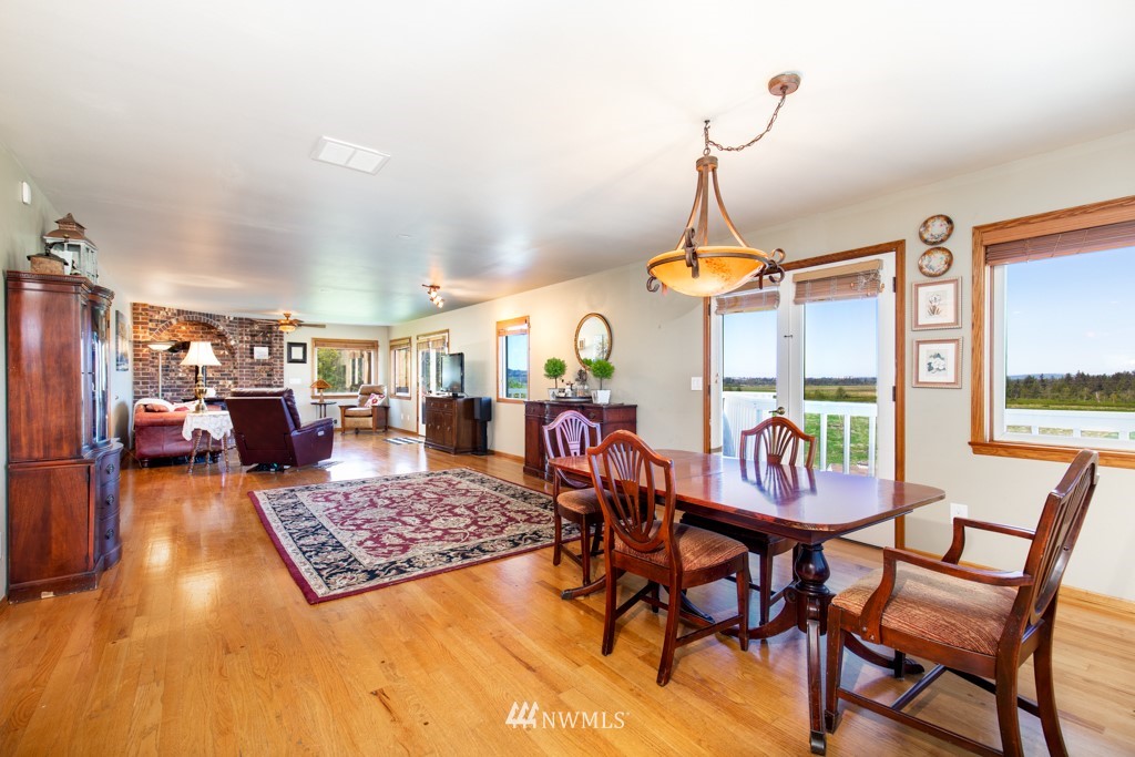 6815 Skipley Road Snohomish, WA 98290 - Photo 12 of 36 a living room with furniture a rug and a chandelier