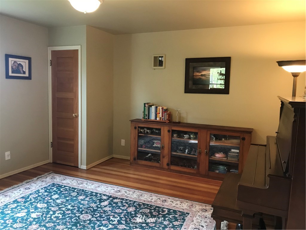 6815 Skipley Road Snohomish, WA 98290 - Photo 15 of 36 a view of a workspace with furniture and wooden floor
