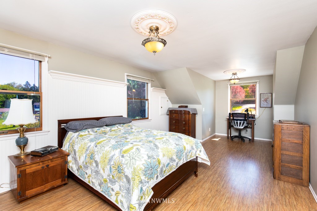 6815 Skipley Road Snohomish, WA 98290 - Photo 20 of 36 a bedroom with a bed and a chandelier
