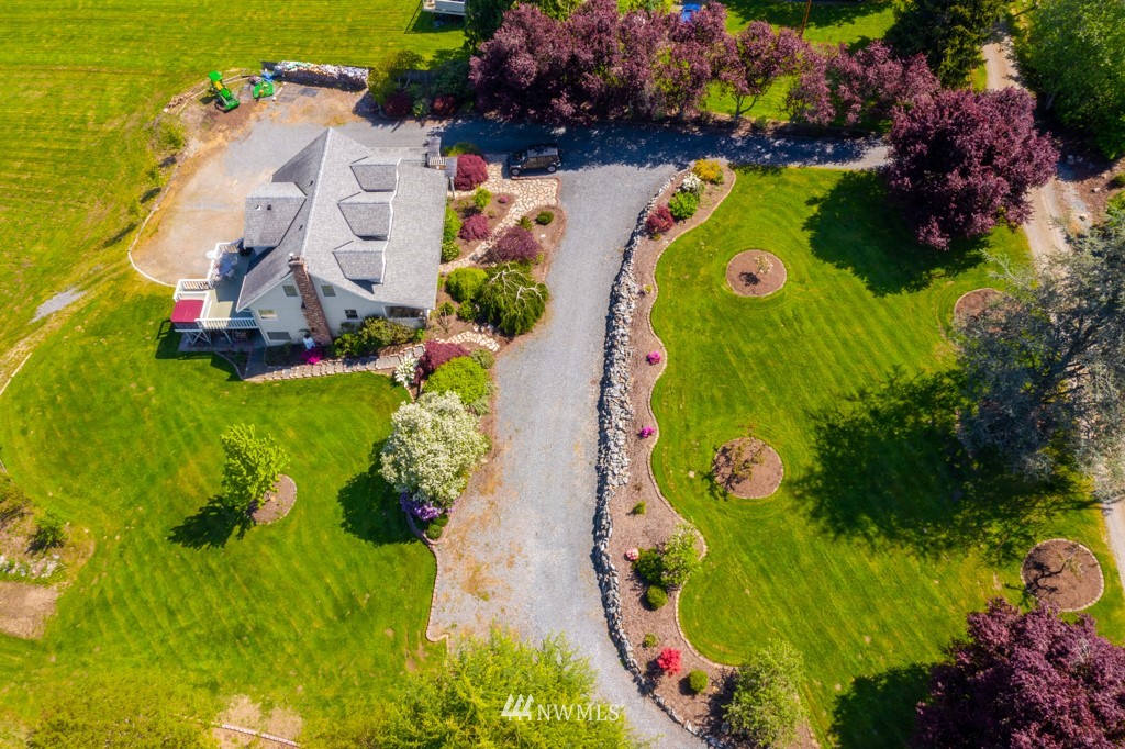 6815 Skipley Road Snohomish, WA 98290 - Photo 3 of 36 an aerial view of a house with a garden and swimming pool