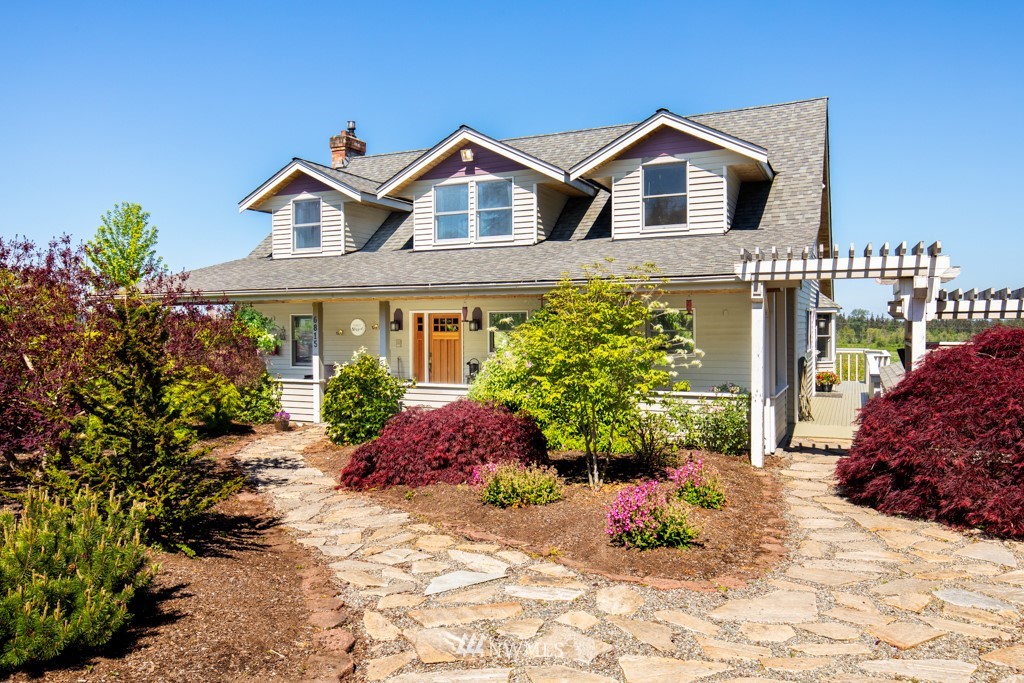 6815 Skipley Road Snohomish, WA 98290 - Photo 5 of 36 a front view of a house with a yard
