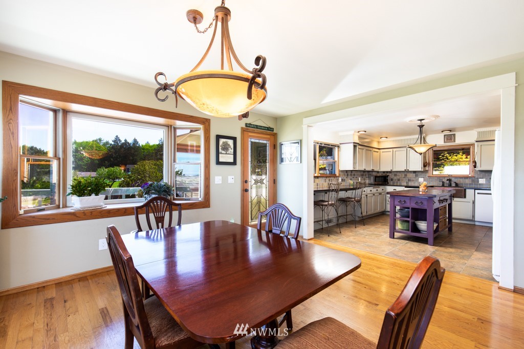 6815 Skipley Road Snohomish, WA 98290 - Photo 10 of 36 a view of a dining room with furniture window and wooden floor