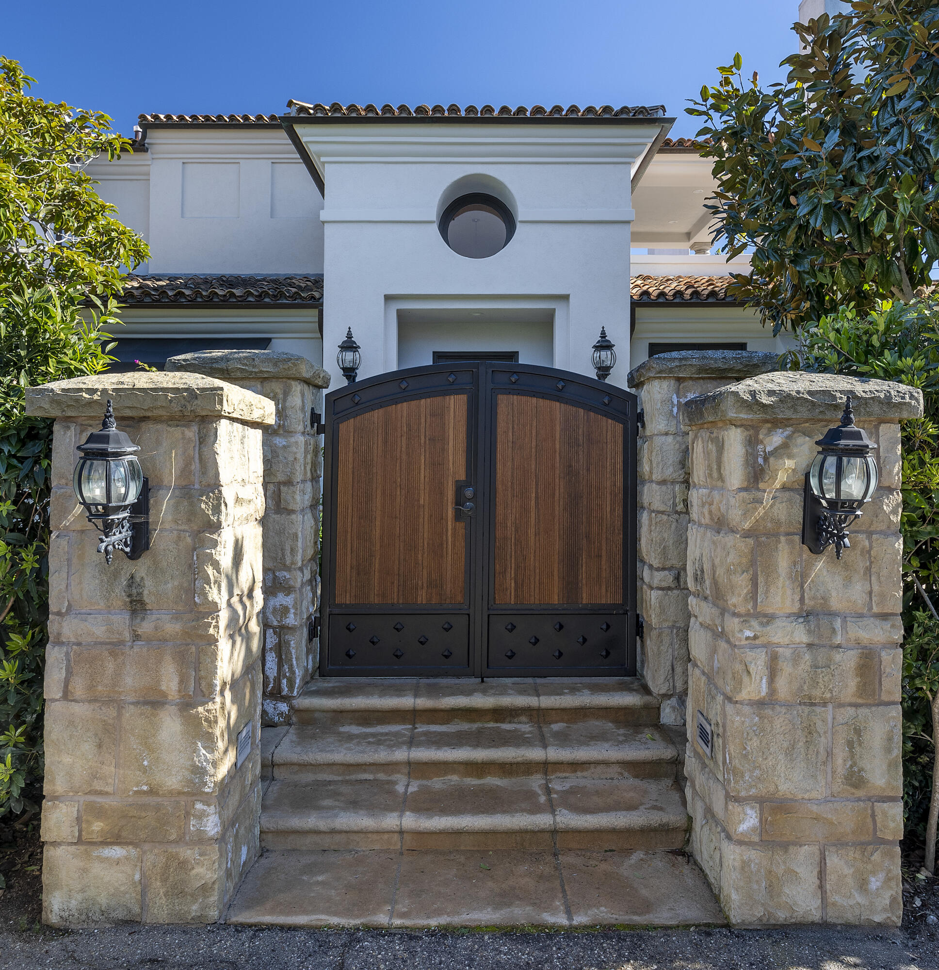 1138 Hill Road Santa Barbara, CA 93108 - Photo 22 of 25 a front view of a house with a garden
