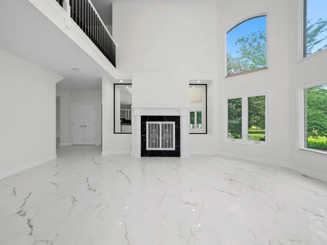 a large kitchen with a large counter top appliances and cabinets