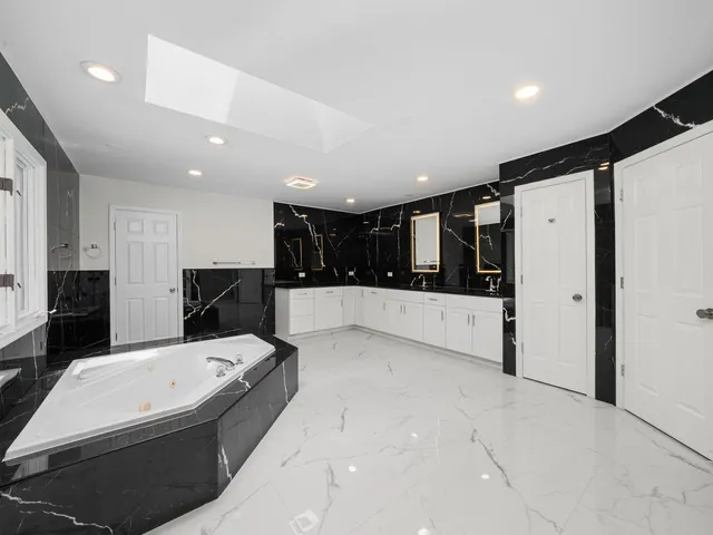 a bed room with a bed and a window