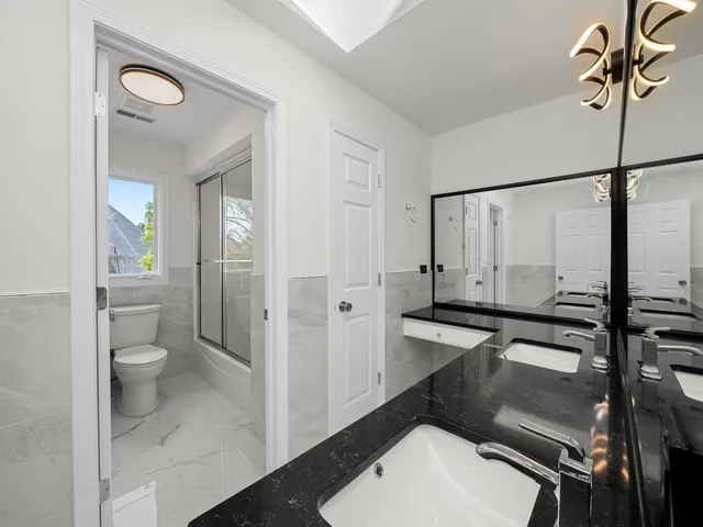 a view of an empty room with a fireplace