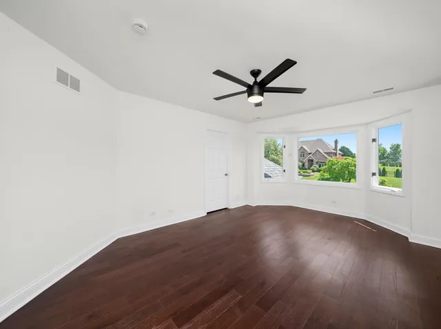 a bedroom with a bed and a night stand