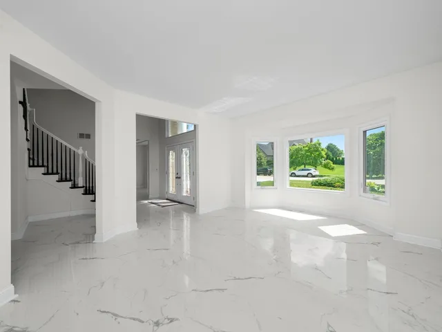 a view of a dining room with furniture window and outside view
