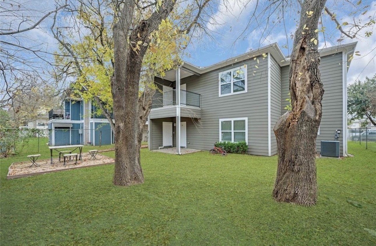 6122 West Mt Houston Road, Unit 4 Houston, TX 77088 - Photo 11 of 11 a front view of a house with a garden