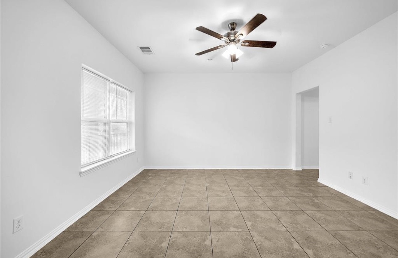 6122 West Mt Houston Road, Unit 4 Houston, TX 77088 - Photo 4 of 11 a view of an empty room with a window