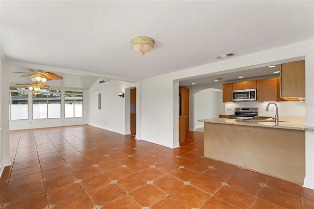 a view of a kitchen with kitchen appliances and a window