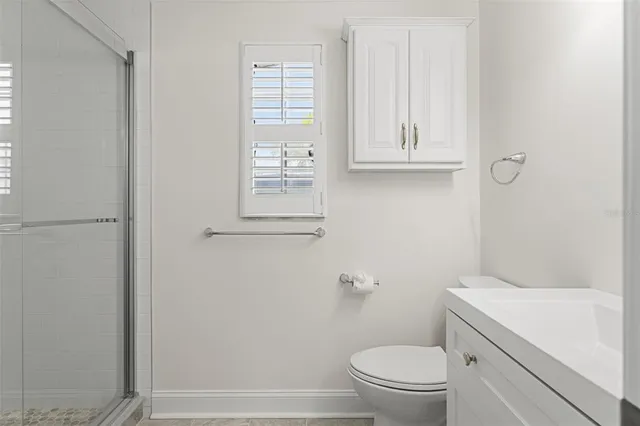 a view of a big room with closet and windows