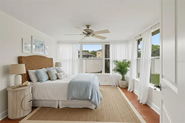 a spacious bedroom with a bed and a couch