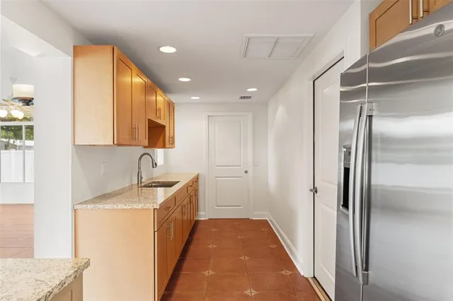 a bathroom with a sink a mirror and a shower