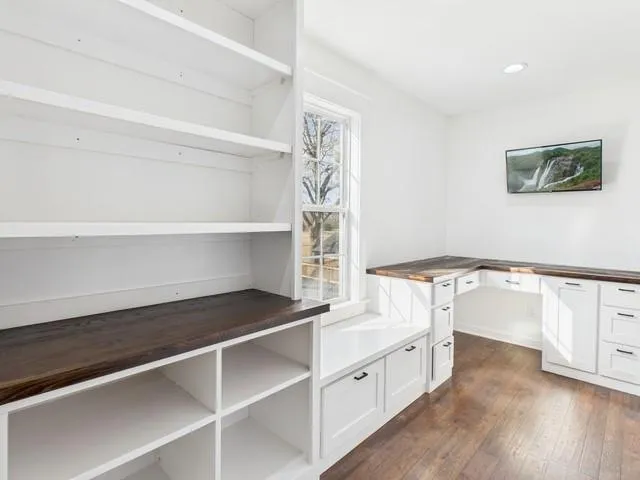 a view of cabinets and wooden floor